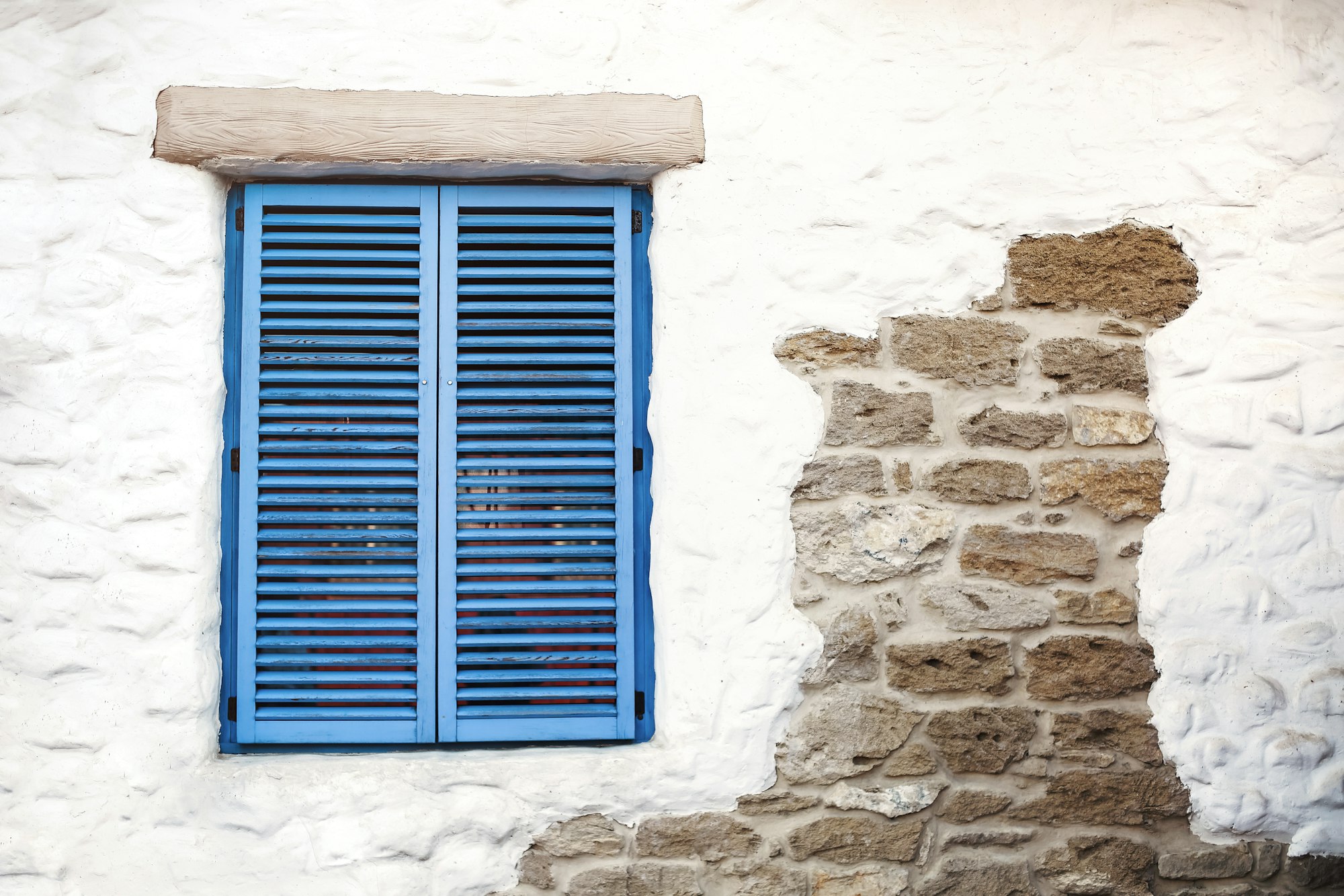 Old window with blue shutters