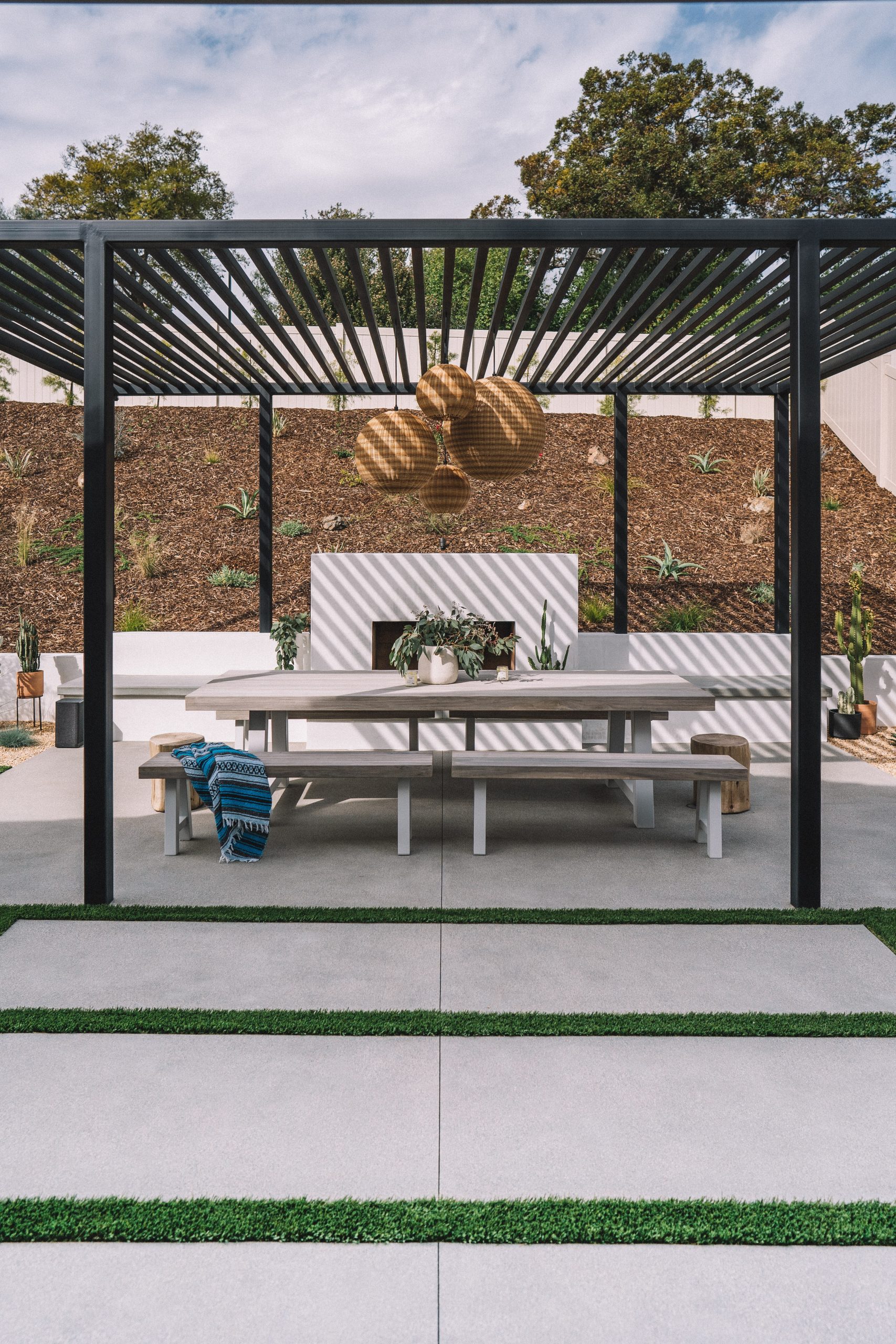 Modern automated louvered pergola, an ideal outdoor window treatment for a San Diego patio.