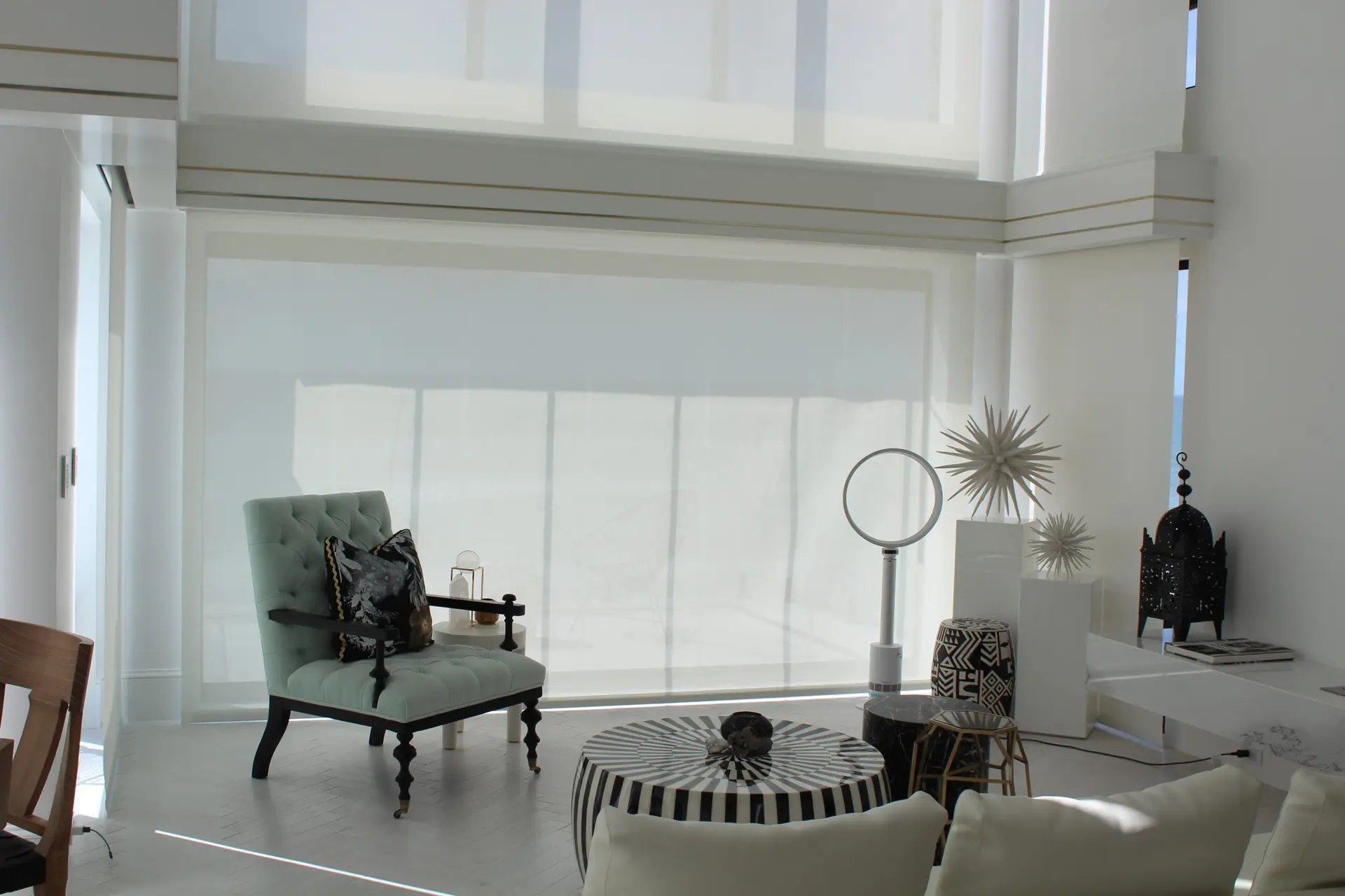 Custom automated roller shades with a Lutron system in a San Diego home.