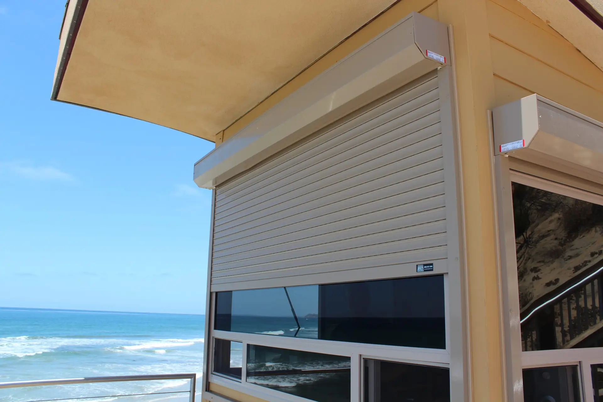 Heavy-duty exterior rolling shutters, a strong outdoor window treatment for security and storm protection.